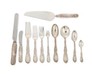 1117
Mid/late 20th century
A Tiffany "Chrysanthemum" Sterling Silver Flatware Service
Each marked: Tiffany & Co / Sterling / Pat.1880.M
The set designed 1880, comprising 6 table knives (10.25"), 6 place forks (7.5"), 6 luncheon forks (6.325"), 6 salad forks (6.75"), 6 cream soup spoons (6.75"), 6 dessert spoons (7"), 6 tea spoons (5.75"), 6 oyster forks (5.875"), 6 demitasse spoons (4"), 6 butter spreaders (5.875"), and 1 pie/cake server (10.75"), sold together with 4 Tiffany & Co porcelain dinner plates in the Chrysanthemum pattern, 65 pieces
Weighable sterling: 91.265 oz. troy approximately
Estimate: $4,000 - $6,000