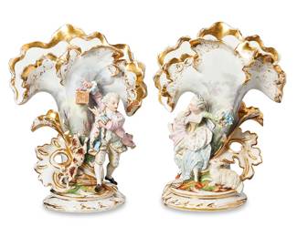 1121
Late 19th century
A Pair Of Old Paris Porcelain Spill Vases
Each with a Rococo-style pastoral scene with gilt highlights depicting a figure in fancy dress issuing a wide, fanned vase, 2 pieces
Each: 15" H x 11.5" Dia.
Estimate: $400 - $600