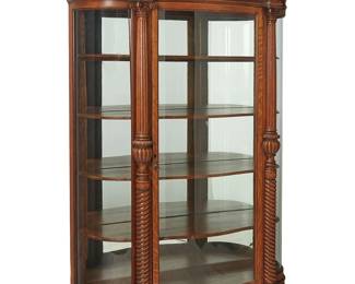 1127
Late 19th/early 20th century
A Renaissance Revival Vitrine
The five-shelf display cabinet with curved original glass viewing panels to front and sides, a mirrored back panel, and a door with brass hardware and locking mechanism, featuring composite capped columns transitioning into rope twist lower columns, surmounted by a pediment and cornice with scrolled acanthus leaf motif, set on flattened bun feet
86" H x 50.25" W x 19" D
Estimate: $3,000 - $5,000