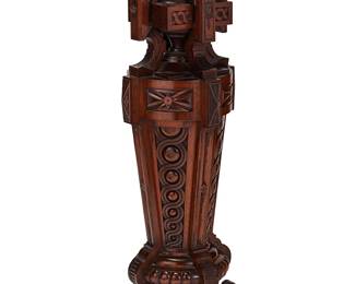 1131
Late 19th century
A Victorian Gothic Revival Wood Pedestal
The carved wood pedestal with a birdseye maple platform surmounting an openwork interlocking sculptural cross and tapered form profusely decorated with various carved geometric details including ovolo and beaded molding, set on four paw feet
48" H x 17.325" W x 17.325" D
Estimate: $1,000 - $1,500