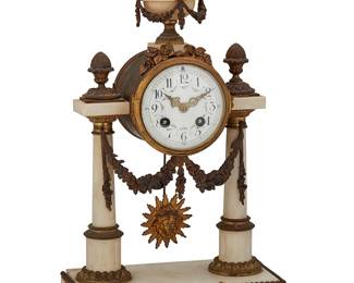1134
Late 19th/Early 20th Century
A French Neoclassical Portico Mantel Clock
Movement signed: A.D. Mougin / Deux Medaille / 3187
The bronze and marble mantel clock with two-train movement and black Arabic numerals on the enameled metal dial, set in a bronze case with a masked sun gilt pendulum, mounted to a white marble columnar base decorated with mounted bronze and gilt accents, pinecone finials, and surmounted by an urn, set on six bronze feet
16.75" H x 8.875" W x 4.625" D
Estimate: $600 - $800