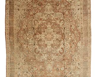 1145
20th century
A Tabriz Area Rug
The wool-on-cotton foundation rug with foliate motifs surrounding a central medallion on a tan ground
18' 7" L x 13' 11" W
Estimate: $7,000 - $9,000