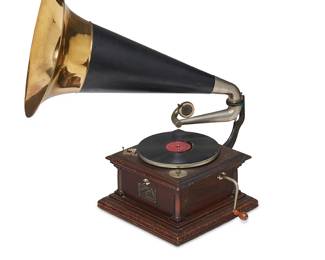 1149
Circa 1905-1912
A Victor IV Phonograph
With metal label: Victor / Made by Victor Talking Mch. Co. / Type Vic IV; serial number: 40763
The phonograph featuring a mahogany case, 10" turntable, double spring motor, tapered arm configuration, and an external steel and brass horn
Assembled: 28.5" H x 29" W x 16.25" D approx., dimensions variable
Estimate: $1,000 - $1,500