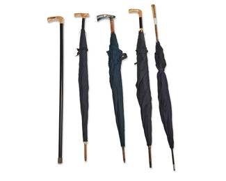 1158
20th century
A Group Of Umbrellas And A Cane
Each unmarked
Comprising one cane with gold-toned metal handle, two ebonized wood umbrellas with gold-toned metal handles, one wood umbrella with gold-toned metal and mother of pearl handle, and one wood umbrella with faux wood and silver-toned metal openwork overlay on bone handle, four personalized, 5 pieces
Largest: 39.625" L x 1" Dia.; smallest: 36" L x 0.75" Dia.
Estimate: $300 - $500