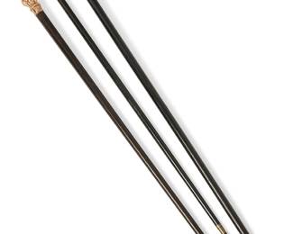 1157
Late 19th/early 20th century
A Group Of Ebonized Wood Walking Canes
Each appears unmarked
Comprising three canes each with a cast gold metal handle decorated with scroll, foliate, and floral motifs, 3 pieces
Largest: 36.5" H x 1.5" Dia.; smallest: 36.25" H x 1.5" Dia.
Estimate: $600 - $800