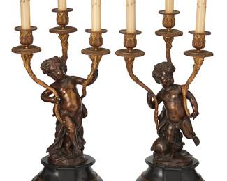 1167
Late 19th century
A Pair Of French Figural Bronze Candelabra
Each three-light candelabrum with a patinated bronze young Dionysius figure donning a wreath of grapes and supporting three foliate gilt bronze candleholders, set upon a black stone pedestal base, 2 pieces, electrified
Each: 22.25" H x 9" W x 7" D
Estimate: $800 - $1,200