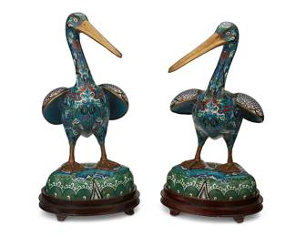 1182
Mid-20th century
A Pair Of Chinese Brass And Cloisonné Pelicans
Each appears unmarked
Each brass pelican with all-over enameled scrollwork and avian motifs and carved, lacquered wood stand, 4 pieces
Each with stand: 19.5" H x 9" W x 10.5" D
Estimate: $800 - $1,200
