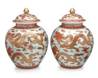 1191
20th century
A Pair Of Chinese Enameled Porcelain Ginger Jars
Marked to the underside in blue underglaze bearing an apocryphal reign mark for Yongzheng Period (1723-1735)
Each decorated in all-over red enamel and gilt five claw dragon, flaming pearl, cloud, and bat motifs on a white ground, 2 pieces
Each: 13.25" H x 7.5" Dia.
Estimate: $500 - $700