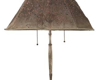 1204
Circa 1902-1928; New York, New York
An L.C. Tiffany Silvered Metal Table Lamp With Enameled Mesh Shade
Shade embossed under finial: Louis C. Tiffany Furnaces Inc. / 890 A / Pat. Appd. For; base embossed to the underside: Tiffany Studios / New York / 618
The enameled metal mesh shade with applied multicolor droplets, silver rope-style borders, and cast silver flattened bottom tear drop-shaped finial on a two-light, adjustable silvered metal base with cast Art Nouveau bamboo and lily motifs, electrified
20.5" H x 17.75" Dia.
Estimate: $2,000 - $3,000