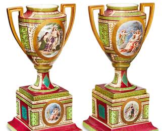 1221
Late 19th/early 20th century
A Pair Of Royal Vienna-Style Porcelain Vases
Each marked with blue Bindenschild; one further marked: Austria (possibly mark of Josef Riedl Giesshubel)
Each porcelain urn-form vase with opposed handles centering reserves with Classical-style scenes enclosed by gilt-highlights against a magenta and light green ground, 2 pieces
Each: 18.5" H x 8.25" W x 8.25" D
Estimate: $700 - $900