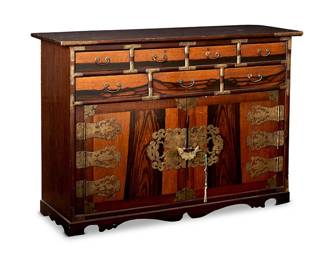 1224
Late Joseon Dynasty 1392-1910 or later
A Korean Keyaki Wood Safe Chest
Appears unmarked
Likely a Korean Gakkesuri or locking safe chest, the wood carcass with seven drawers arranged in two rows surmounting two doors, secured with a padlock, and opening to reveal interior shelving; all adorned with elaborate brass plates and hardware
34.5" H x 48.5" W x 16.75" D
Estimate: $600 - $800