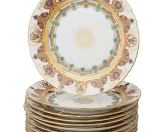 1230
Circa 1825-1855, Period of Nicholas I
A Set Of Russian Imperial Porcelain Plates
Each marked with blue underglaze imperial monogram for Nicholas I
Each porcelain plate with a scalloped rim, gilt highlights, and polychrome interlacing surrounding the Russian Imperial eagle, 12 pieces
1.25" H x 9.75" Dia.
Estimate: $2,000 - $3,000