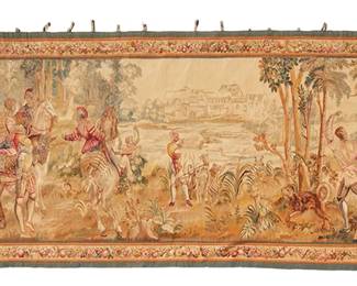 1234
19th century; Aubusson, France
An Aubusson Wool And Silk Tapestry
Appears unmarked
Inspired by the 16th century "Les Chasses de Maximilien" series of twelve hunting tapestries, the finely woven tapestry in multicolored wool, silk and metal threads, depicting a partial scene of a forest and royal hunting party, with townscape beyond, and with polychrome fruit, flora and fauna borders, fully lined and with mounting loops attached to the top edge
4' 4" H x 13' 8" W
Estimate: $2,000 - $3,000
