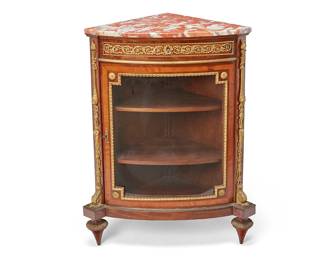 1235
Late 19th century; Paris, France
A Victor Raulin Louis XVI-Style Encoignure
Impressed to the top: Raulin
The corner cabinet with single drawer over a locking glazed door revealing three interior shelves, surmounted by a rouge marble top and finished with gilt-bronze mounts and satinwood inlay
38" H x 27.5" W x 17.25" D
Estimate: $2,500 - $3,500