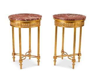 1237
20th century
A Pair Of Neoclassical Side Tables
Each gilt metal table with pierced floral motif apron and four columnar legs with tapered feet joined by a curvilinear X-stretcher, surmounted by a red marble top, 2 pieces
Each: 28.5" H x 18.75" Dia.
Estimate: $400 - $600