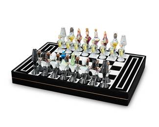 1248
Circa 1960-1962
A Vista Alegre "Christians Vs. Moors" Chess Set
Each piece marked to underside: Made in Portugal / VA Portugal
The black and white Lucite board with painted porcelain game pieces designed by Jeannine Hétreau
Board: 2.325" H x 13.325" W x 19" D; largest game pieces: 4.5" H
Estimate: $1,000 - $2,000