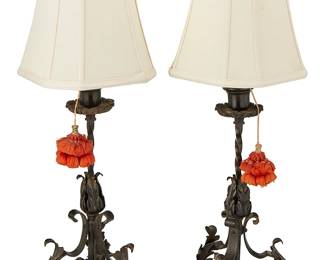 1255
Early/mid-20th century
A Pair Of Spanish Colonial-Style Wrought Iron Table Lamps
Each appears unmarked
Each single-light lamp with wrought iron scrollwork and foliate tripod base and linen shade, electrified, 2 pieces
Each: 24" H x 9" Dia.
Estimate: $500 - $700