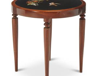 1258
20th century
A Pietre Dura Side Table
The maple wood circular table with black stone top with inlaid cut stones depicting a bird and flowers, set on four tapered turned wood legs
19" H x 19.125" Dia.
Estimate: $500 - $700