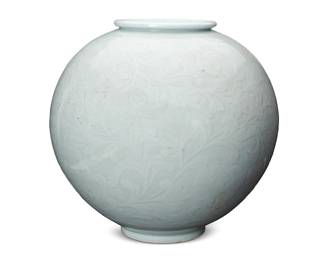 1265
Late 20th century
A Joseon-Style Porcelain Moon Vase
Marked to the underside with artist's name (possibly reading): Myeong Deuk/Meitoku
With impressed scroll motifs and an all-over pale green glaze
16.25" H x 13" Dia.
Estimate: $500 - $700