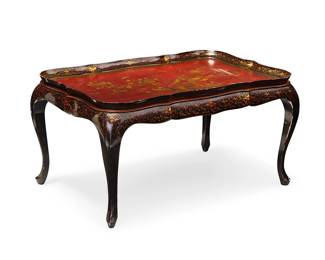 1270
Mid/late 20th century
A Chinoiserie Lacquered Wood Coffee Table
Appears unmarked
The red and black lacquered, carved wood table with gilt accents depicting avian and foliate motifs on the tabletop; set upon four modified cabriole legs
17.5" H x 34" W x 22" D
Estimate: $400 - $600