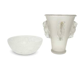 1279
Mid/late 20th century
Two Lalique Glass Vessels
The bowl with etched mark to underside: Lalique ® France; one stencil sand blasted: LALIQUE/ FRANCE
Each in an Art Deco style, comprising a "Saint Emilion" (designed 1942) frosted glass vase with four high relief bird and foliate accents, and a "Pinsons" (designed 1933, relaunched 1951) etched and frosted glass bowl depicting finches and a foliate motif, 2 pieces
Vase: 10.125" H x 9.25" Dia.; bowl: 3.625" H x 9.325" Dia.
Estimate: $700 - $900