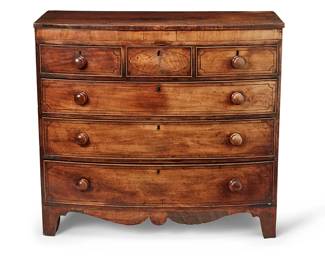 1286
Early 19th century
A Federal Mahogany Veneered Chest Of Drawers
The cherry wood dresser with three short drawers over three long drawers, each with brass locking mechanisms, replaced wood hardware, and inlaid stringing, raised on four carved wood legs joined by a curvilinear apron
41.25" H x 45.5" W x 21.5" D
Estimate: $400 - $600