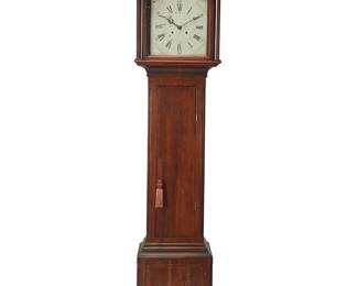 1288
19th century
A George III Hepplewhite-Style Longcase Clock
Appears unmarked
The two-train movement mahogany case clock with Roman and Arabic numerals, phases of the moon, and days of the month, housed in a bonnet with glass viewing panels to the sides and glazed door to the front, surmounted by a swan neck broken pediment centering an urn finial above two full relief reeded columns with Doric capitals, the trunk featuring quarter relief columns centering a cabinet door and set on bracket feet
101" H x 22.5" W x 10.5" D
Estimate: $800 - $1,200