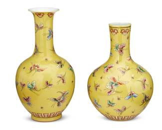 1296
Mid/late 20th century
Two Yellow Ground Butterfly Vases
Each marked to the underside in blue underglaze with an apocryphal reign mark for Qianlong Period (1711-1799)
Each slightly different stick neck-form ceramic vase with all-over polychrome enameled decoration of fluttering butterflies on a mustard-colored ground, 2 pieces
Larger: 14.5" H x 7" D; smaller: 12.25" H x 7" Dia.
Estimate: $500 - $700
