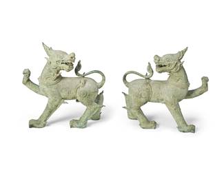 1299
19th century or later
A Pair Of Southeast Asian Archaic-Style Bronze Guardian Lions
Each appears unmarked
Each possibly depicting the Singha, a mythical beast of protection in the form of part dragon, part lion, cast in bronze with stylized scroll-work motifs throughout and an all-over verdigris patination; each set upon a later added plinth base, 4 pieces
Each with base: 48" H x 32" W x 12" D
Estimate: $4,000 - $6,000