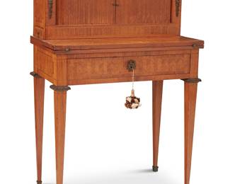 1306
Late 19th/early 20th century
A Louis XVI-Style Parquetry Bonheur Du Jour
The desk with a tambour superstructure revealing four drawers flanking an open cavity and two side drawers at the exterior, above a hinged top and a drawer with locking mechanism, featuring fruitwood inlays and bronze hardware and mounted accents, raised on squared attenuated legs with brass feet
40.25" H x 28.625" W x 16.25" D
Estimate: $1,000 - $2,000
