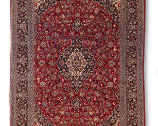 1311
20th century
A Heriz Area Rug
The wool-on-cotton foundation rug with olive green and salmon foliate motifs surrounding a central medallion on burgundy ground
15' L x 11' 3" W
Estimate: $1,500 - $2,500