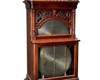 1313
Late 19th/early 20th century; Rahway, NJ
A Regina "Corona" Self-Changing 27-Inch Disc Music Box
Marked to the interior: Copyright 1894 / Regina Music Box Co.
With a mahogany case replete with a spindled gallery top, turned corner columns, and openwork carving of two dragons above the inset glazing of the hinged, upper door, opening to reveal a printed allegorical image of one of the Muses of Greek Mythology, Erato, playing a lyre for the infant Hermes surrounded by putti on the rear interior wall and twelve, 27-inch metal discs, each for playing a different melody; set upon four metal casters
74.5" H x 38" W x 23.5" D
Estimate: $4,000 - $6,000