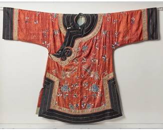 1316
Late Qing dynasty 1644-1911 or later
A Framed Chinese Embroidered Silk Robe
A five-button side closure cinnabar red silk damask short robe with multicolored silk and metallic thread embroidery depicting various birds, bats, moths, butterflies and floral motifs, with multicolored applied braid and black trim at neck and sleeves, and with blue lining, professionally framed and mounted within a custom Plexiglas frame
40" H x 55.5" W at shoulders; 30" W at hem
Estimate: $2,000 - $3,000