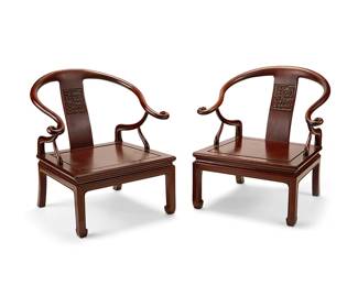 1322
20th century
A Pair Of Chinese Quanyi Chairs
Each chair featuring crest rails of a modified horseshoe shape surmounting a carved backsplat, supported by curvilinear arms set into a flat beveled seat set upon four legs, 2 pieces
Each: 30.5" H x 28.75" W x 25.5" D
Estimate: $700 - $900