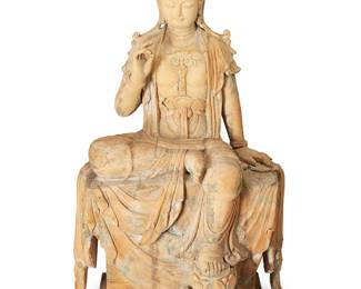 1321
17th century or later
A Large Carved Wood Figure Of Guanyin
The Water Moon (Shuiyue) Guanyin depicted in the posture of "royal ease" or rajalilasana, heavily adorned with jewelry and a tiara centering an Amitabha, and enrobed in flowing garments draped over an elaborate rock-form plinth base; traces of gilt and polychrome throughout
62" H x 30" W x 22" D
Estimate: $2,000 - $4,000