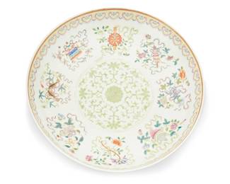 1324
Guangxu Period 1875-1908 or later
A Chinese Famille Rose Bajixiang Porcelain Platter
Marked to the underside in red enamel bearing the reign mark for Guangxu Period (1875-1908)
The large, low ceramic bowl with enameled decoration of the Eight Auspicious Emblems and floral scrolls surrounding a central medallion and the exterior with stylized floral motifs; along with a carved wood stand, 2 pieces
2.5" H x 13.5" Dia.
Estimate: $3,000 - $5,000