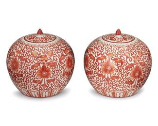 1328
20th century
A Pair Of Chinese Lidded Porcelain Jars
Each appears unmarked
Each with all-over dense stylized vine, lotus, and peach motifs in red enamel on a white ground, 2 pieces
Each: 10" H x 8.5" Dia.
Estimate: $500 - $800