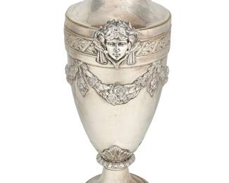 1337
Late 19th/early 20th century
A Continental Neoclassical-Style Silver-Plated Vase
Marked indistinctly to underside, possibly "Kyser"
The large, urn-form vase with figural masks wearing laurel wreaths and floral festoons
20.5" H x 9.25" Dia.
Estimate: $500 - $700