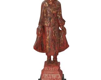 1353
Late 19th/Early 20th century; Mayanmar
A Burmese Carved And Giltwood Mandalay Buddha
Marked with inscribed indecipherable characters in red paint on the base verso
The carved wood standing Buddha figure, painted crimson red with gilt accents, adorned with inlaid multicolor mirrored metal discs forming a crown, and standing on a conformingly decorated pedestal; mounted on later added painted wood stand
With stand: 36.25" H x 13" W x 10.5" D
Estimate: $800 - $1,200
