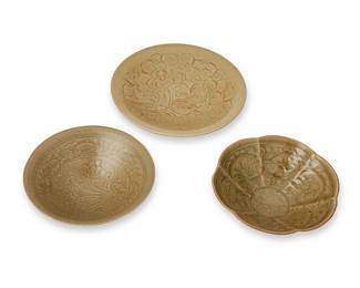 1358
20th century
A Group Of Chinese Yaozhou-Style Celadon Bowls
Each appears unmarked
Each army green glazed bowl with incised and/or impressed floral and fish motifs, 3 pieces
Largest: 2.25" H x 8.75" Dia.; smallest: 2.5" H x 7.25" Dia.
Estimate: $500 - $700