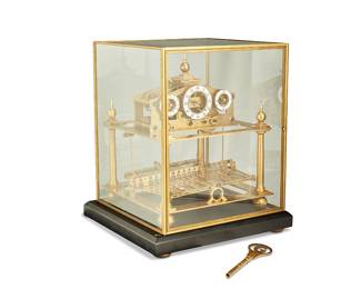 1362
20th century
A Congreve Rolling Ball Clock
Appears unmarked
The gilt and polished brass congreve clock with fusee movement, three porcelain white dials for hours, minutes, and seconds, black Arabic numerals, and a thirty second table, raised on an ebonized wood base and housed in a brass and glass case cover with cabinet door
With cover: 18.625" H x 15.75" W x 15.25" D
Estimate: $2,000 - $3,000