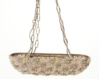 1363
Mid-20th century; Italy
A Murano Glass Millefiori Ceiling Fixture
Appears unmarked
In the manner of Barovier and Toso's "flower basket" lighting fixtures, the four-light fixture with overlapping multicolor, gold flecked glass flowers covering an oblong domed gilt bronze wire basket structure, suspended from a later added brass chain and cast medallion mount
22" H x 21" L x 6.25" D
Estimate: $1,000 - $1,500