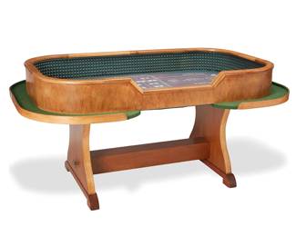 1381
Late 20th/early 21st century
An Oak And Felt Craps Table
Appears unmarked
The oak oval-shaped, trestle-style table with a continuous interior wall lined with green rubber pyramid bumpers encircling the felt-covered gaming board with requisite screen-printed bets, lines, and boxes of the game
32" H x 68" W x 42" D
Estimate: $800 - $1,200