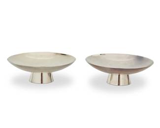 1402
Mid/late 20th century
Two Japanese Jungin Silver Ceremonial Sake Cups
Each marked with a jungin silver mark; one marked: [star]; one marked: [flag] / 1000
Each ceremonial sake cup house in a wooden box bound by a purple ribbon, one with characters for "pure silver sake cup"

Each cup: 1.25" H x 3.625" Dia.; Each box: 2" H x 4.5" W x 4.5" D approximately
4.3 oz. troy approximately
Estimate: $500 - $700