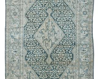 1408
20th century
A Malayer Area Rug
The wool-on-cotton foundation rug with pale blue and brown foliate motifs surrounding a central cartouche on an ivory ground
6' 10" L x 4' W
Estimate: $500 - $700