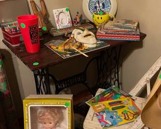 Singer table, frisbee, and doll have sold