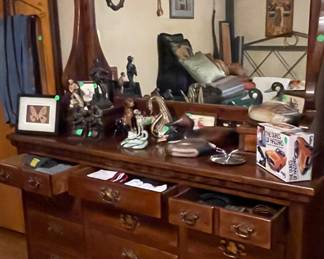 Moth display has sold; Bronze colored statue has sold; Andrea dog figurine has sold 