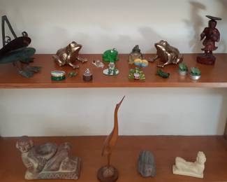Chac Mool Sculptures & Frogs.  Lots of Frogs - There is a Frog Pond in the Back Yard.