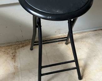 Metal black stool with padded seat