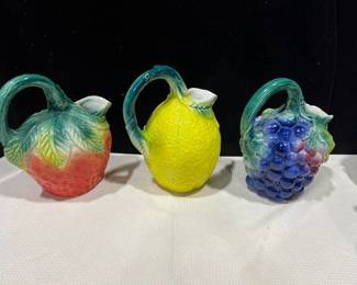 Three pitchers in a fruit design